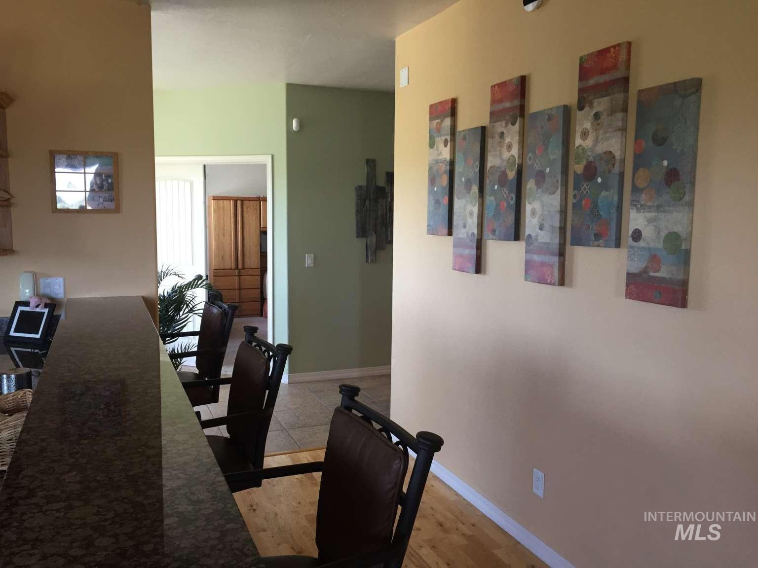 1422 River View Lane Buhl, ID 83316 - Photo 20 of 43 Dining area featuring baseboards and light wood-style flooring