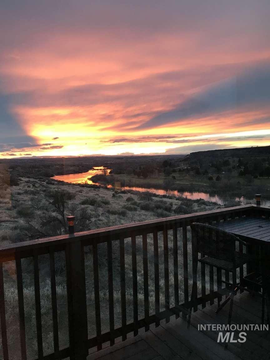 1422 River View Lane Buhl, ID 83316 - Photo 2 of 43 Balcony at dusk featuring a water view