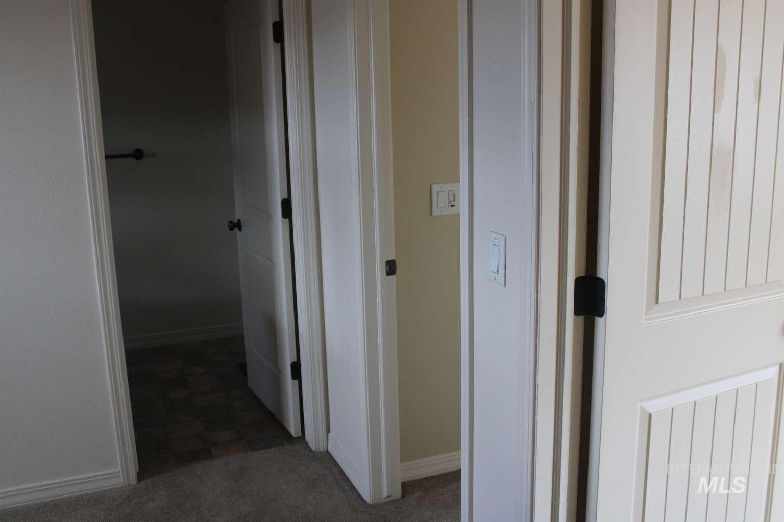 1422 River View Lane Buhl, ID 83316 - Photo 38 of 43 Hall featuring baseboards and dark colored carpet