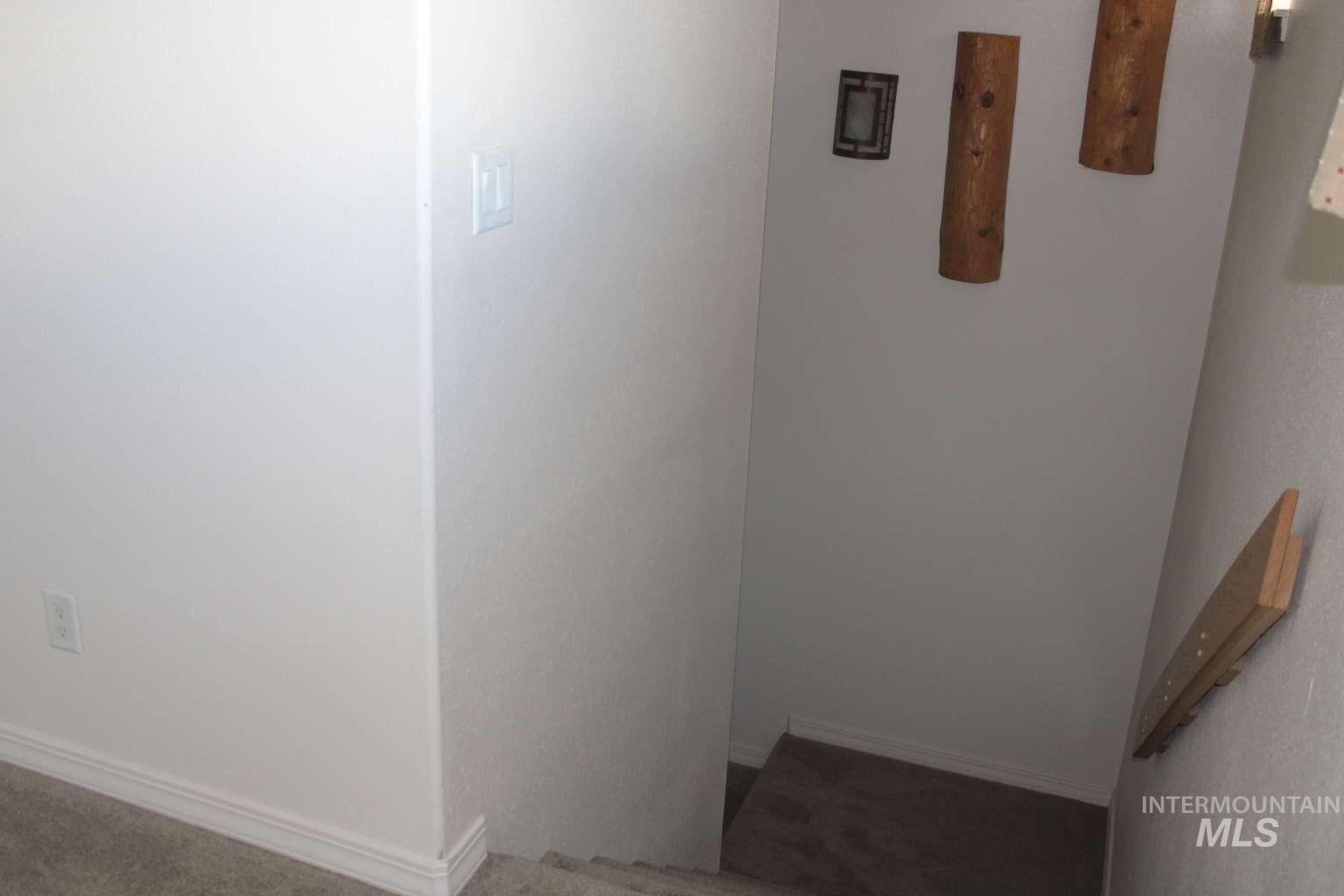 1422 River View Lane Buhl, ID 83316 - Photo 39 of 43 Stairway with carpet floors and baseboards