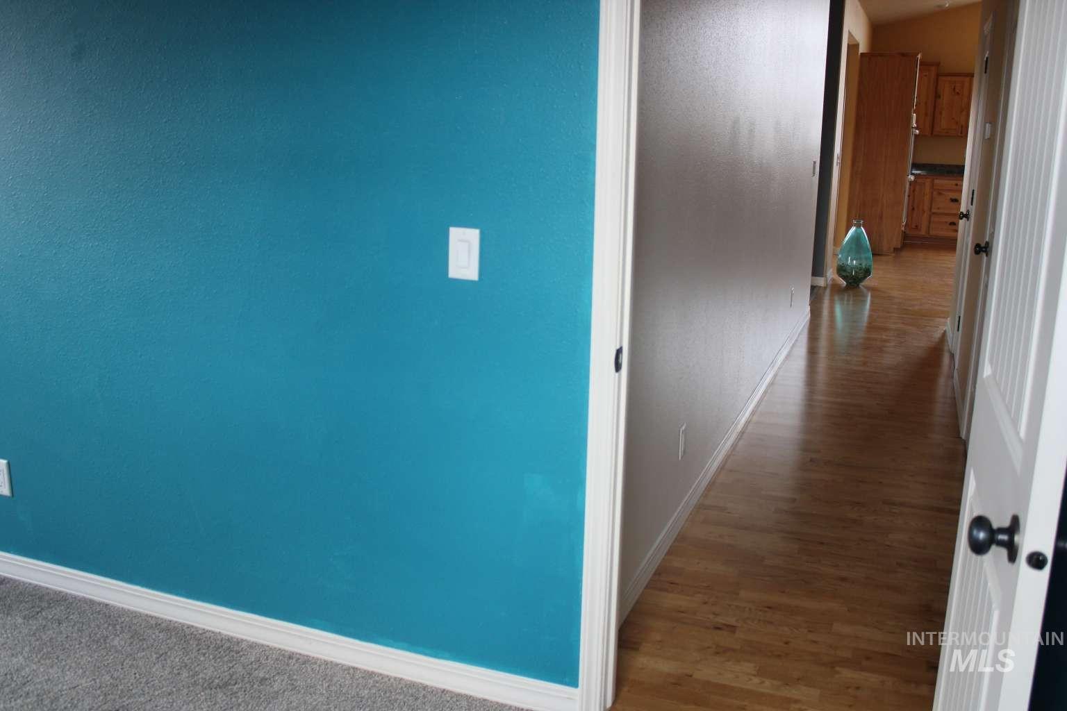 1422 River View Lane Buhl, ID 83316 - Photo 41 of 43 Hallway with baseboards and wood finished floors