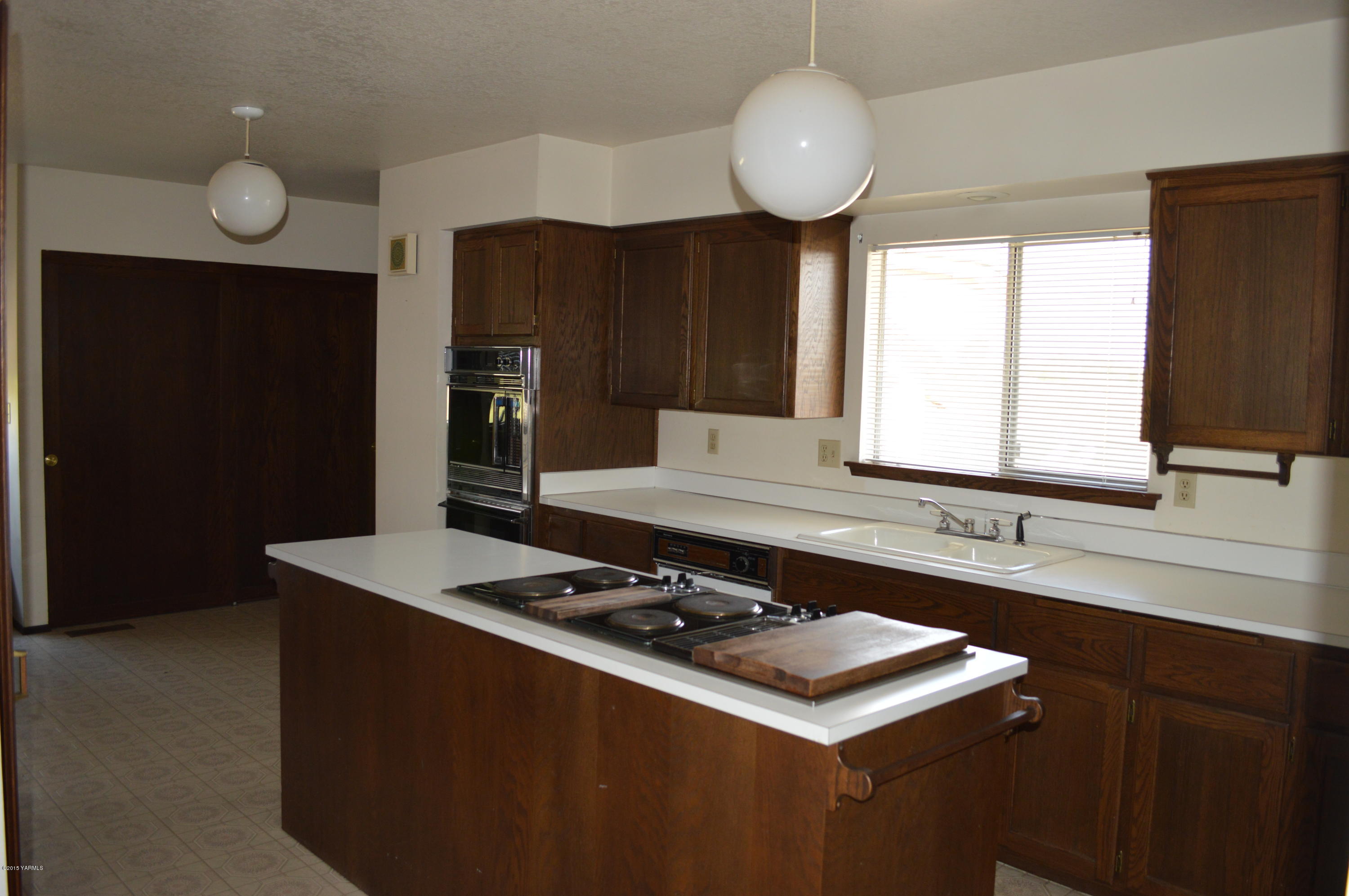 220 Martin Road Toppenish, WA 98948 - Photo 5 of 12 a kitchen with a stove and a sink