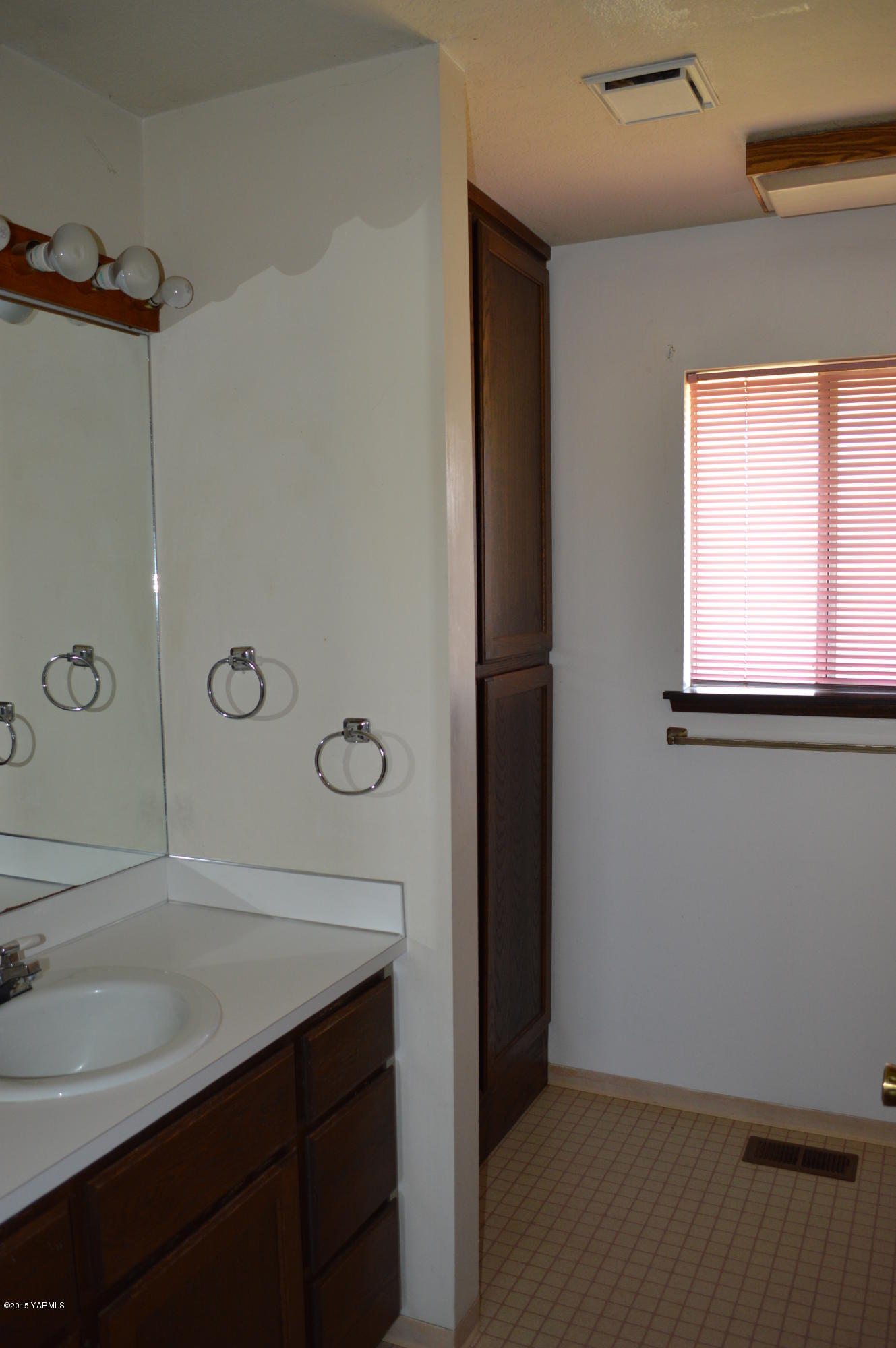 220 Martin Road Toppenish, WA 98948 - Photo 7 of 12 a bathroom with a sink vanity granite and a mirror