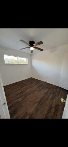 a bathroom with a toilet sink and a mirror