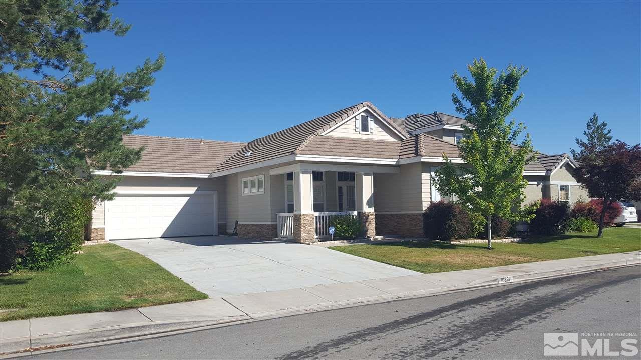 10281 Wolf Ridge Way Reno, NV 89521 - Photo 1 of 22 a front view of a house with a yard and garage