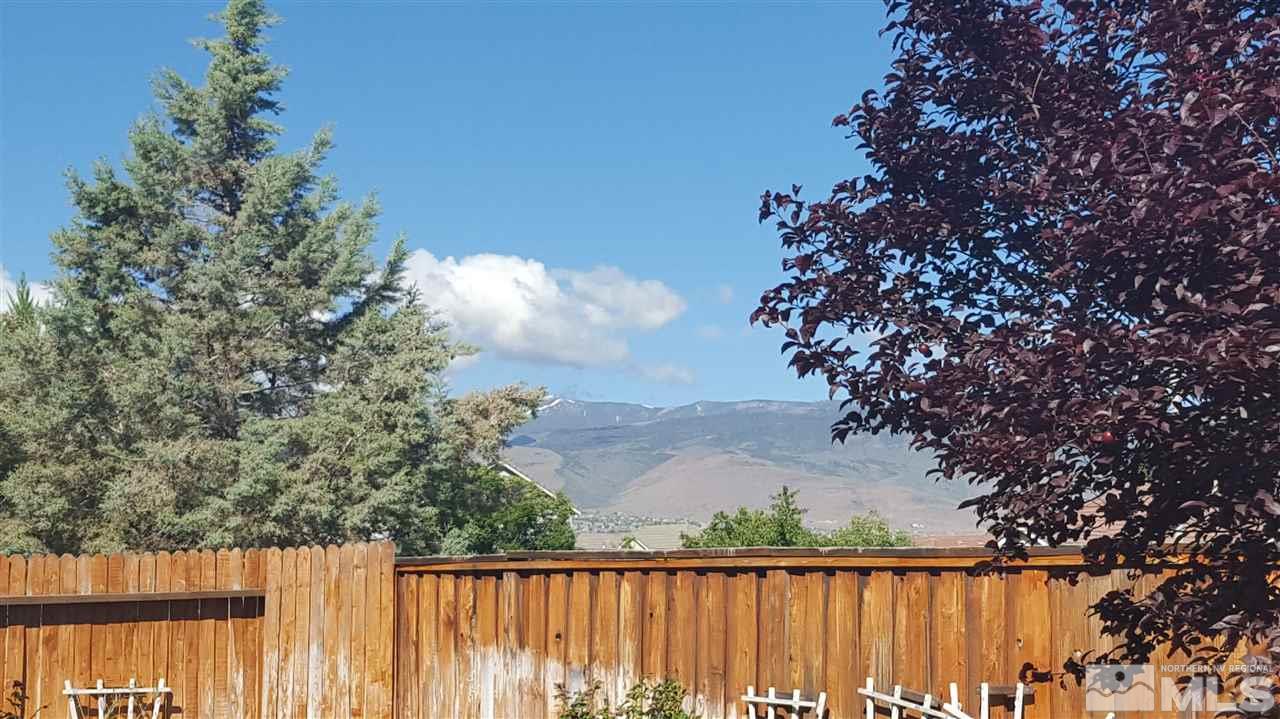 10281 Wolf Ridge Way Reno, NV 89521 - Photo 20 of 22 a balcony with trees in the background