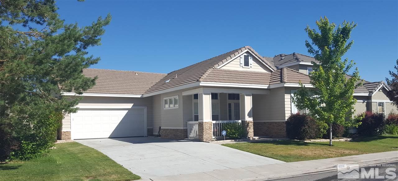 10281 Wolf Ridge Way Reno, NV 89521 - Photo 22 of 22 a front view of a house with a yard and garage
