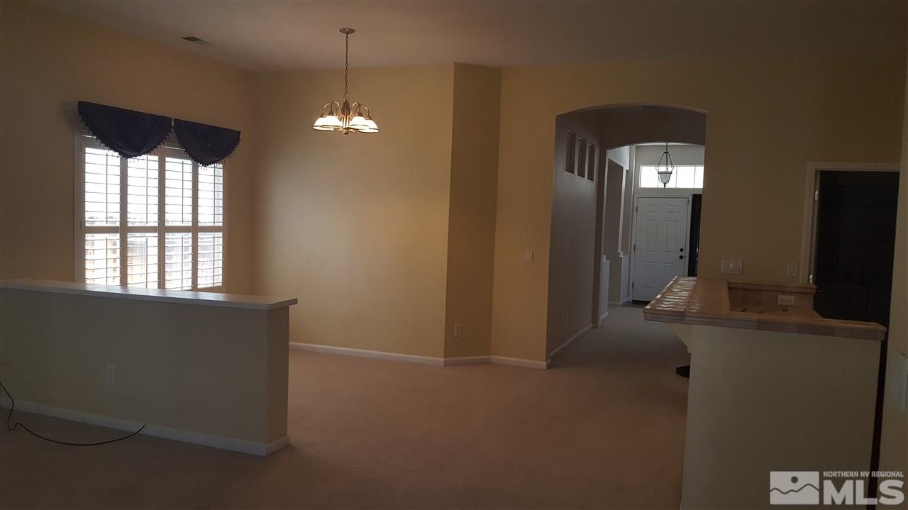 10281 Wolf Ridge Way Reno, NV 89521 - Photo 5 of 22 a view of empty room with window