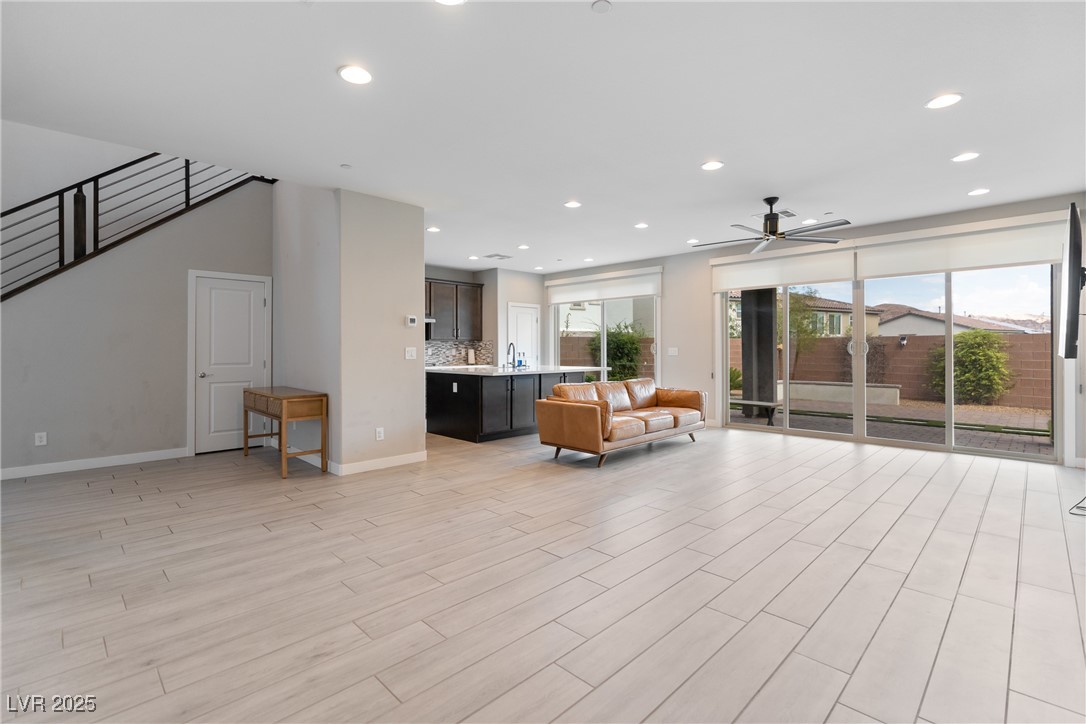 12 Papavero Court Henderson, NV 89011 - Photo 3 of 17 Living room featuring recessed lighting, light wood-style floors, and a ceiling fan