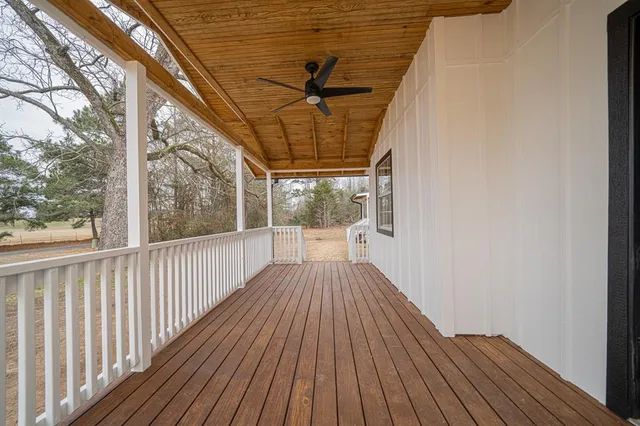 a view of a balcony with wooden floor