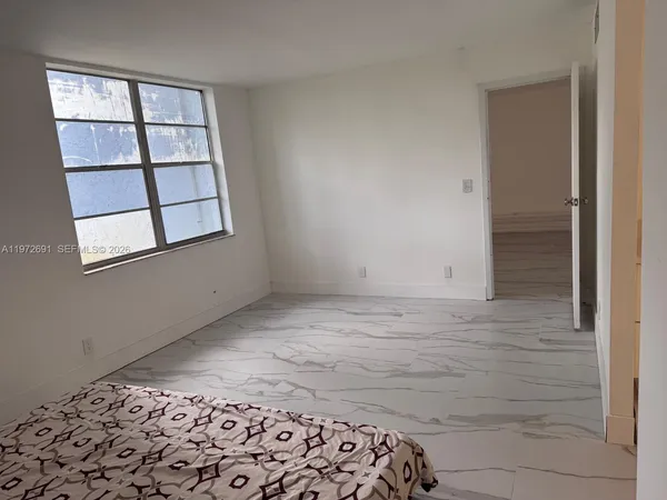 a view of an empty room and window