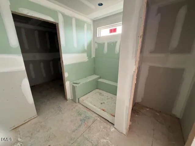 a bathroom with a tub and a sink