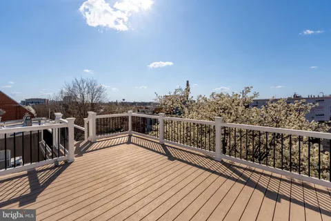 a view of a balcony with wooden floor