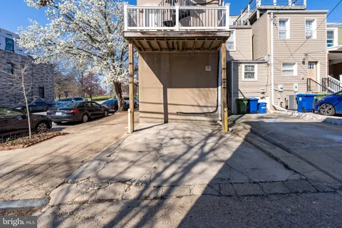 a view of a patio with a table and chairs