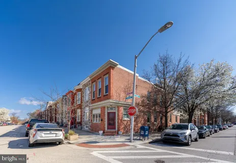 a view of a street with cars on road