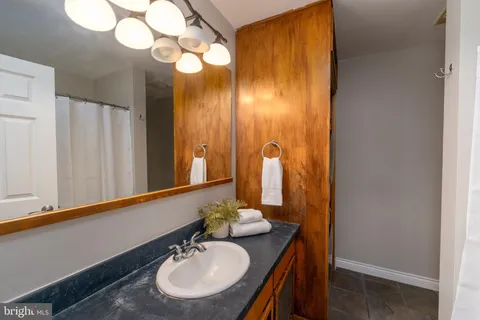 a bathroom with a sink and a mirror