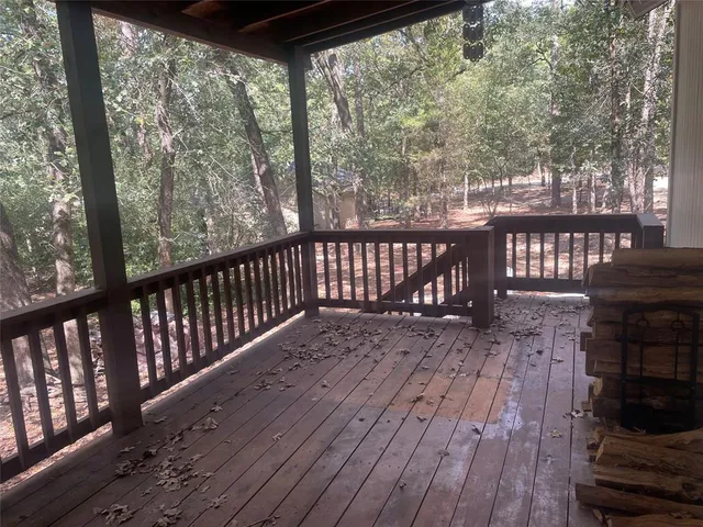 a view of balcony with wooden floor