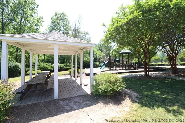 a view of a park with swings and slides