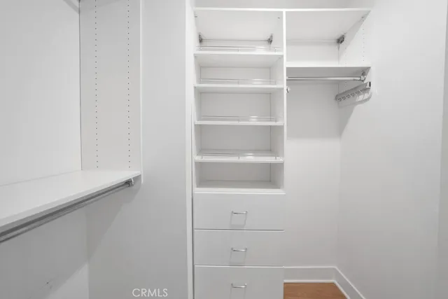 a bedroom with a bed and a view of bathroom