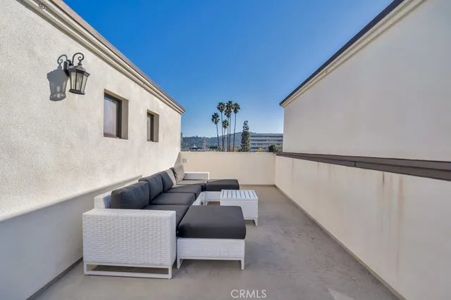a view of a chair and table in the patio