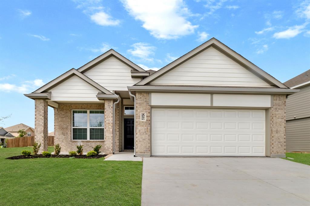 10656 Stag Lane Crowley, TX 76036 - Photo 1 of 13 a front view of a house with a yard and garage