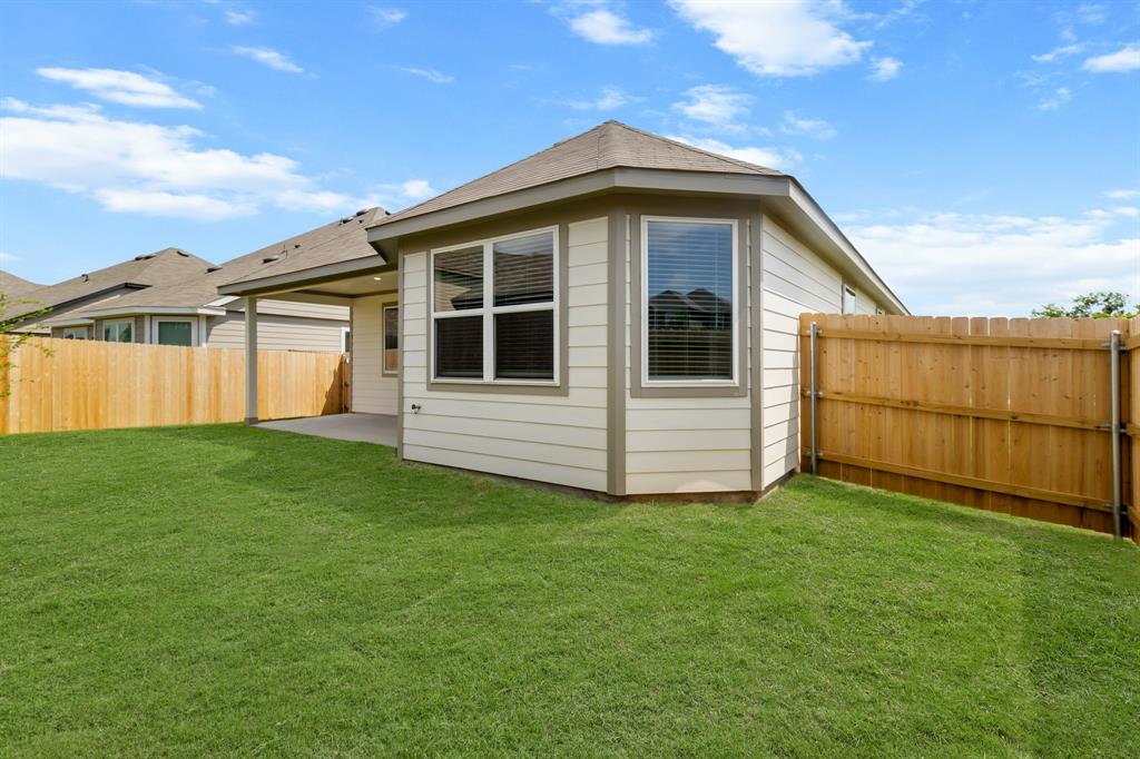 10656 Stag Lane Crowley, TX 76036 - Photo 11 of 13 a view of a house with a yard