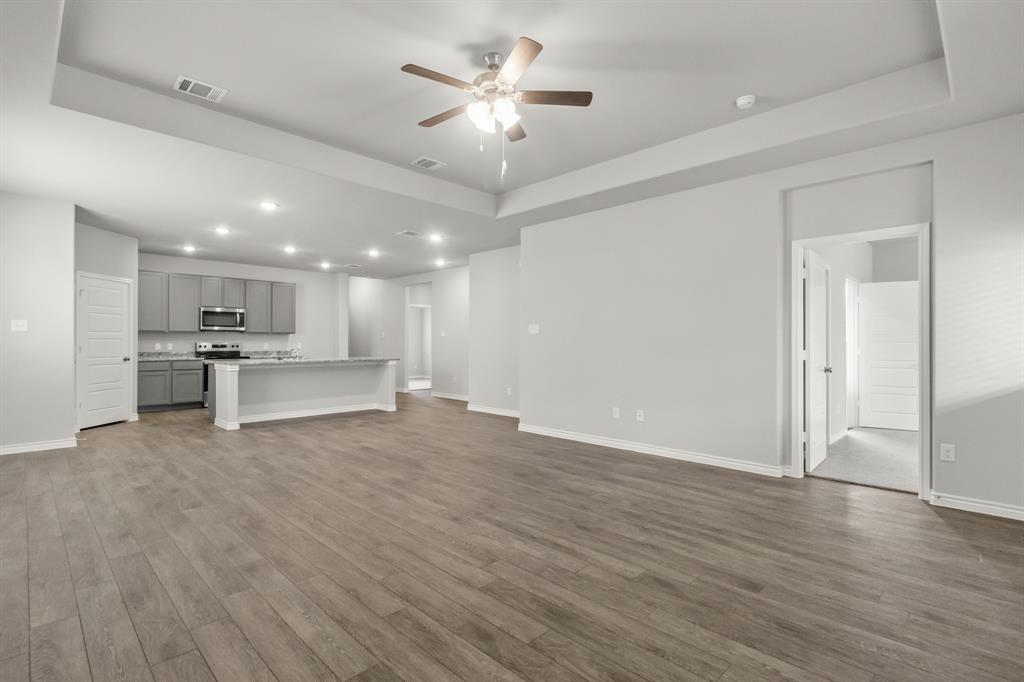 10656 Stag Lane Crowley, TX 76036 - Photo 5 of 13 a view of kitchen with a sink cabinets and wooden floor