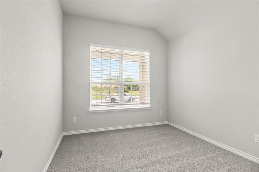 10656 Stag Lane Crowley, TX 76036 - Photo 8 of 13 an empty room with a window