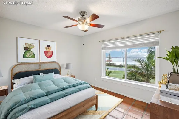 a view of a room with window ceiling fan and window
