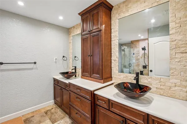 a bathroom with a shower and toilet