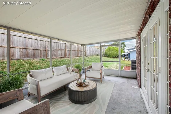 a view of a garden with an outdoor seating