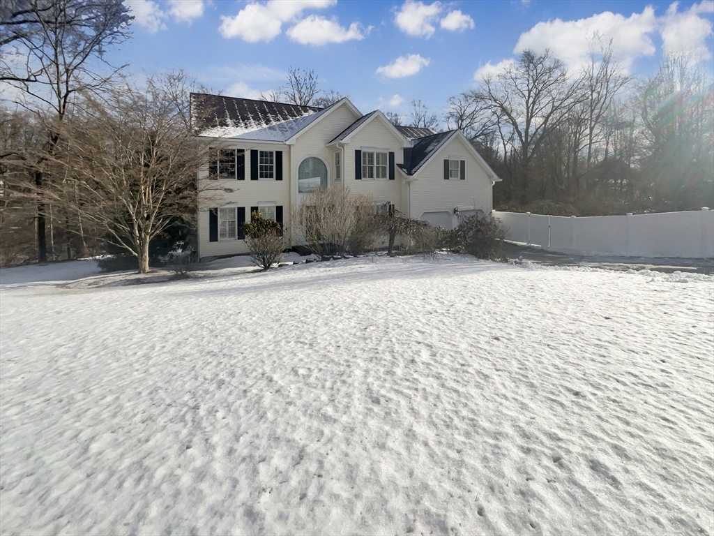 35 Peter Street Holliston, MA 01746 - Photo 1 of 38 a front view of a house with a yard