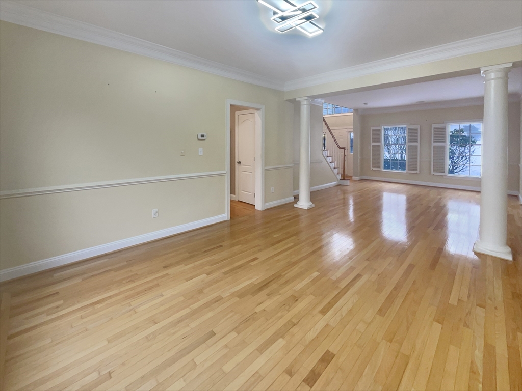 35 Peter Street Holliston, MA 01746 - Photo 13 of 38 wooden floor in an empty room with a window