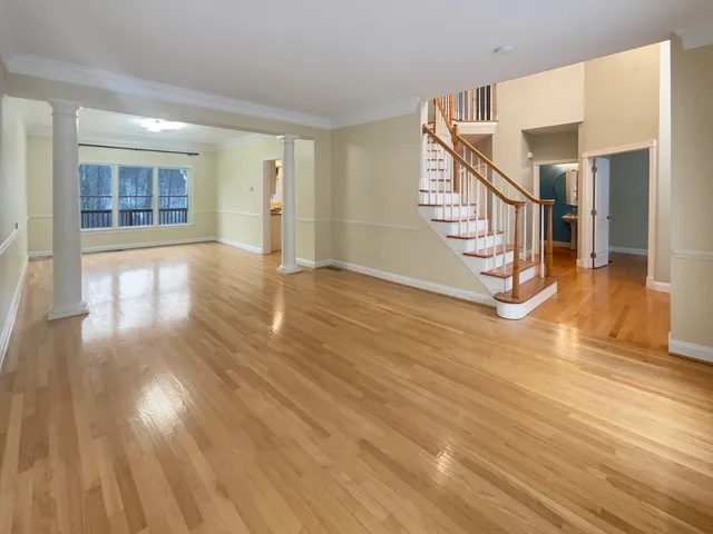 a view of an entryway with wooden floor