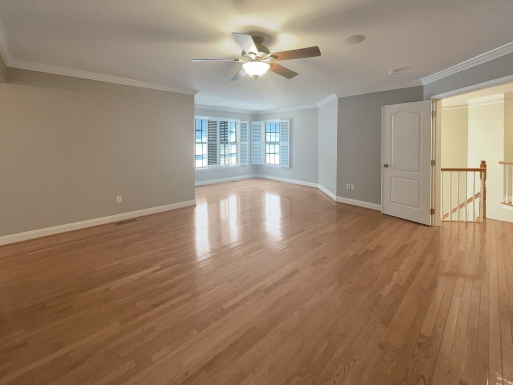 35 Peter Street Holliston, MA 01746 - Photo 17 of 38 a view of an empty room with wooden floor and a window