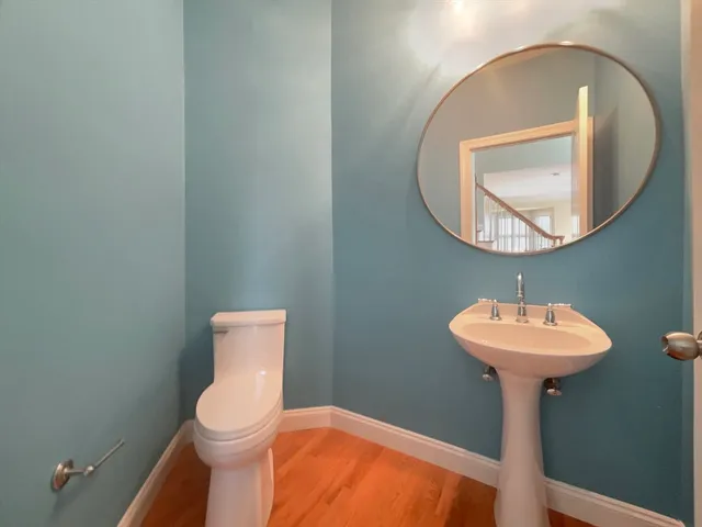 a bathroom with a sink a mirror and a toilet