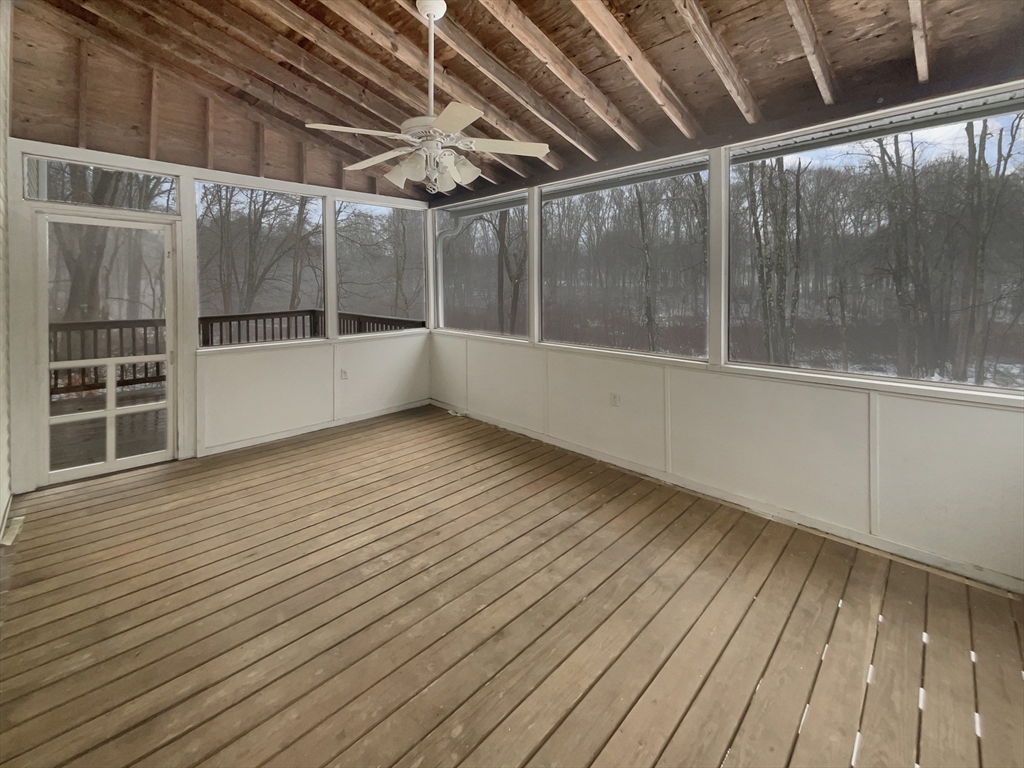 35 Peter Street Holliston, MA 01746 - Photo 37 of 38 a view of an empty room with wooden floor and a window