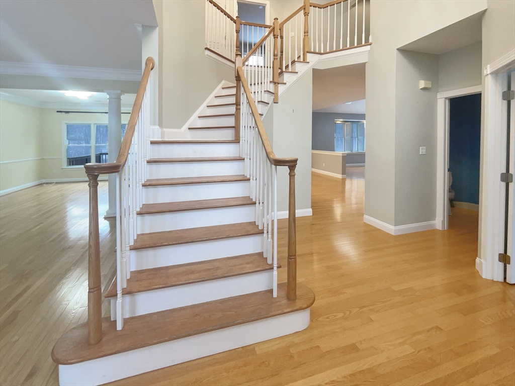 35 Peter Street Holliston, MA 01746 - Photo 10 of 38 a view of entryway and hall with wooden floor