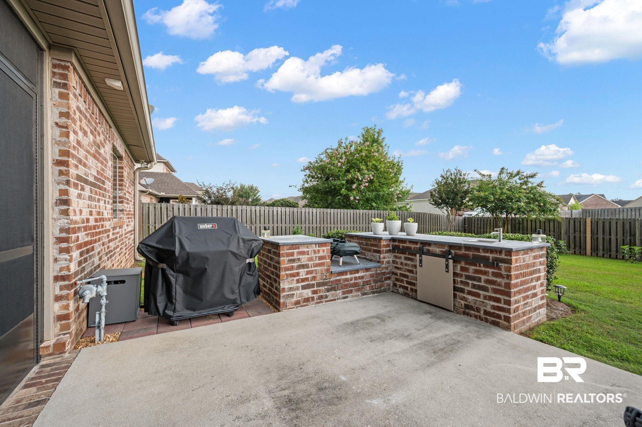 418 Fortune Drive Fairhope, AL 36532 - Photo 52 of 63 View of patio with exterior kitchen and grilling area