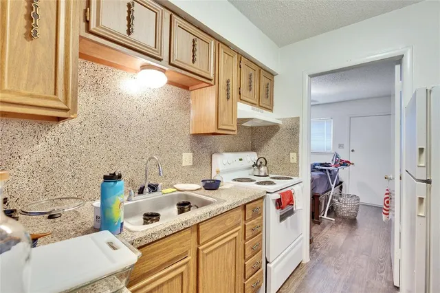 a utility room with a sink dryer and washer