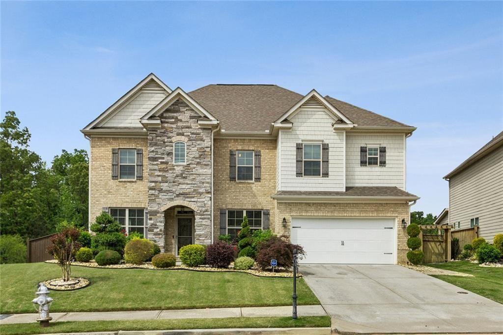 a front view of a house with a yard