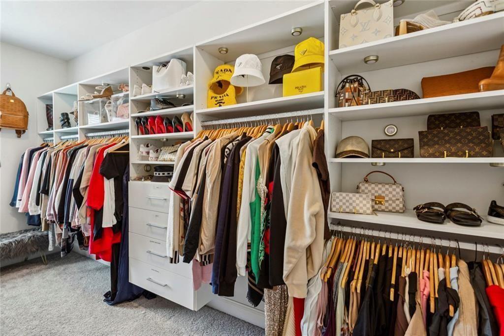 4846 Ralin Court Southwest Atlanta, GA 30331 - Photo 15 of 38 a view of walk in closet with clothes and shoes