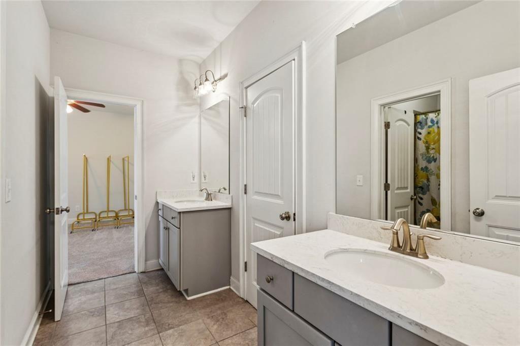 4846 Ralin Court Southwest Atlanta, GA 30331 - Photo 17 of 38 a bathroom with a sink and mirror