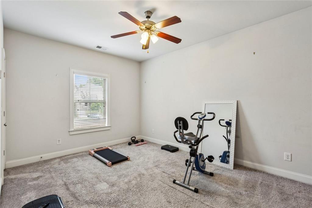 4846 Ralin Court Southwest Atlanta, GA 30331 - Photo 18 of 38 a room with gym equipment and a window