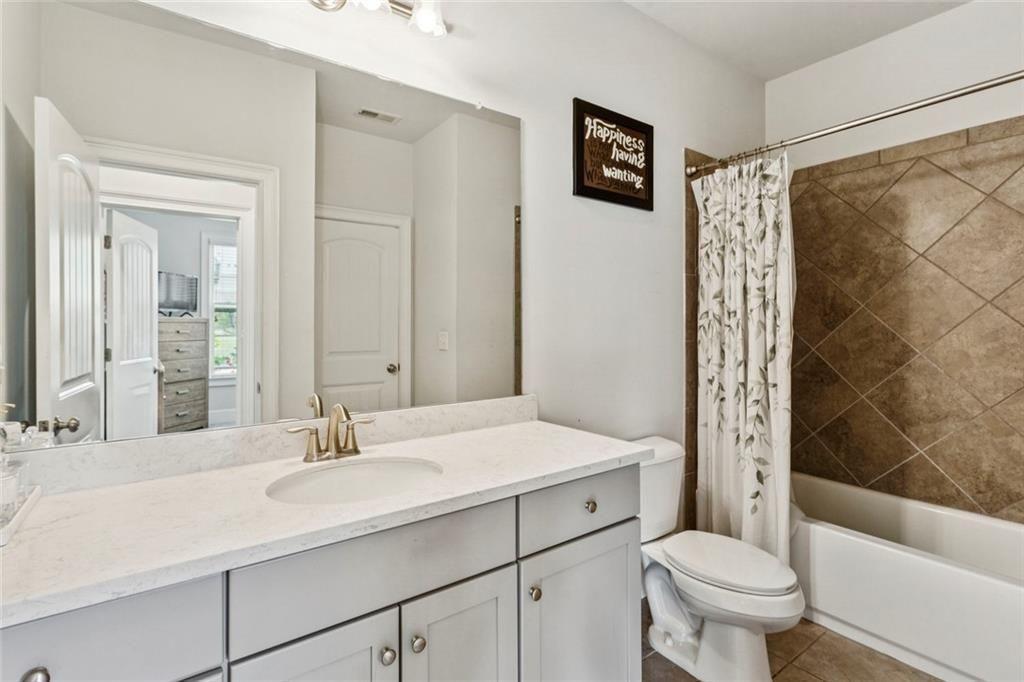 4846 Ralin Court Southwest Atlanta, GA 30331 - Photo 24 of 38 a bathroom with a sink toilet and shower