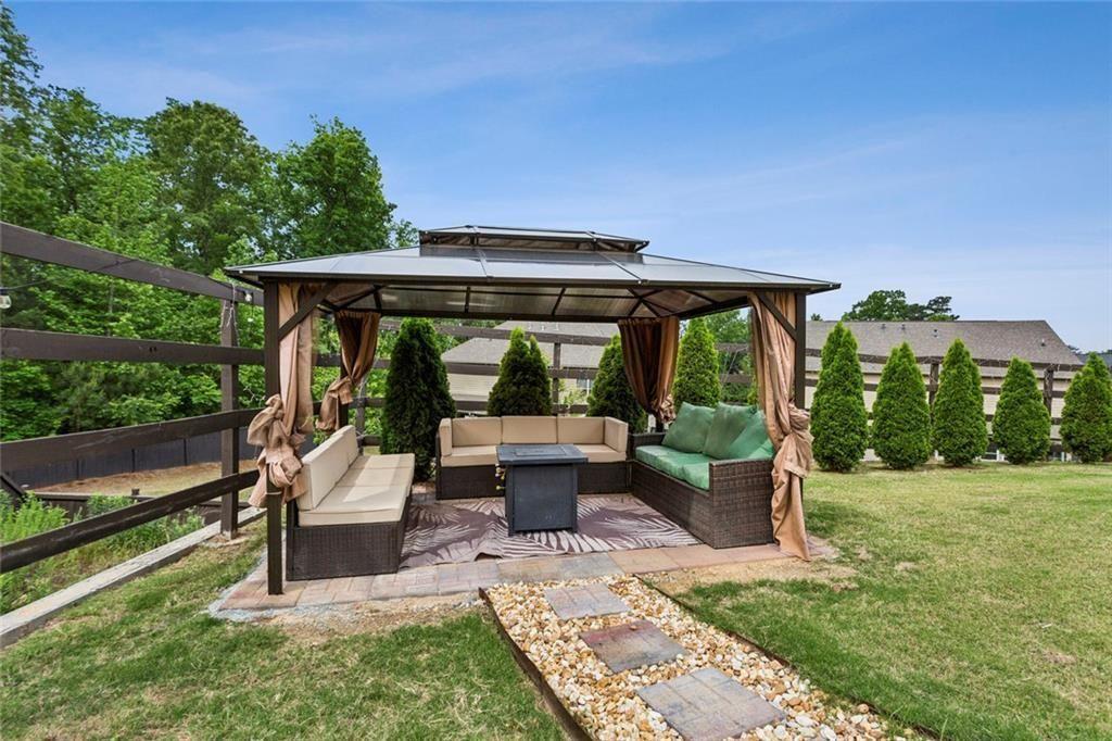 4846 Ralin Court Southwest Atlanta, GA 30331 - Photo 29 of 38 a view of house with backyard outdoor seating and green space