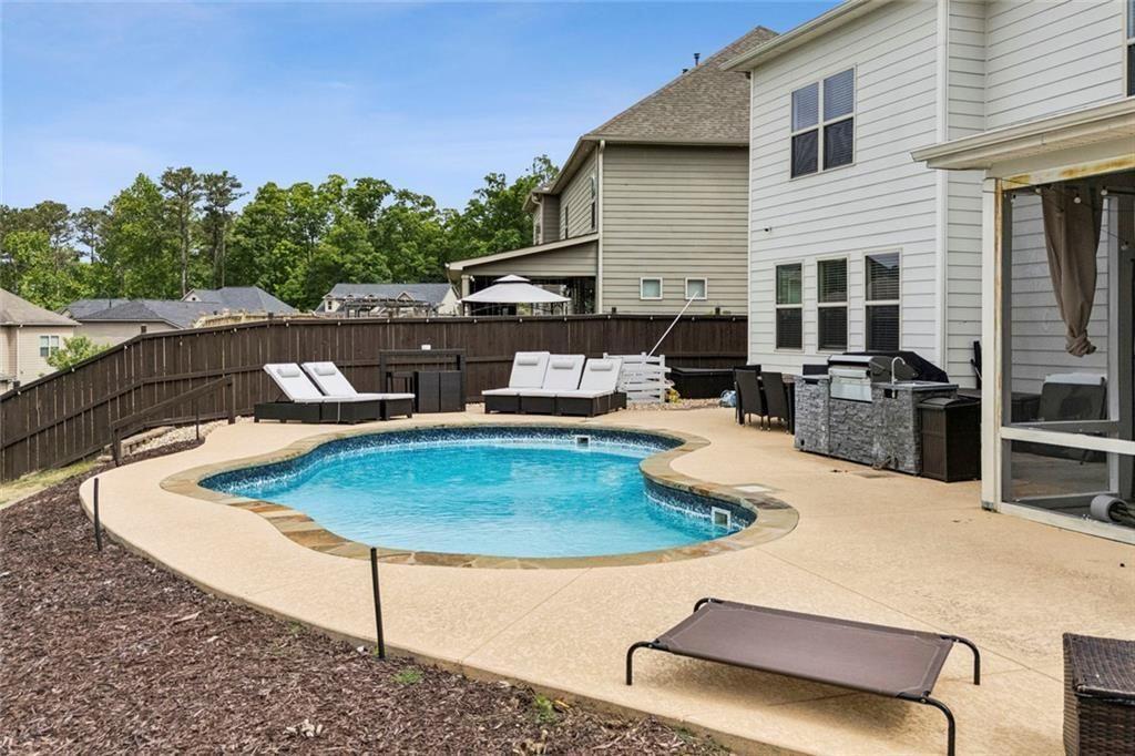 4846 Ralin Court Southwest Atlanta, GA 30331 - Photo 31 of 38 a view of a patio with couches table and chairs