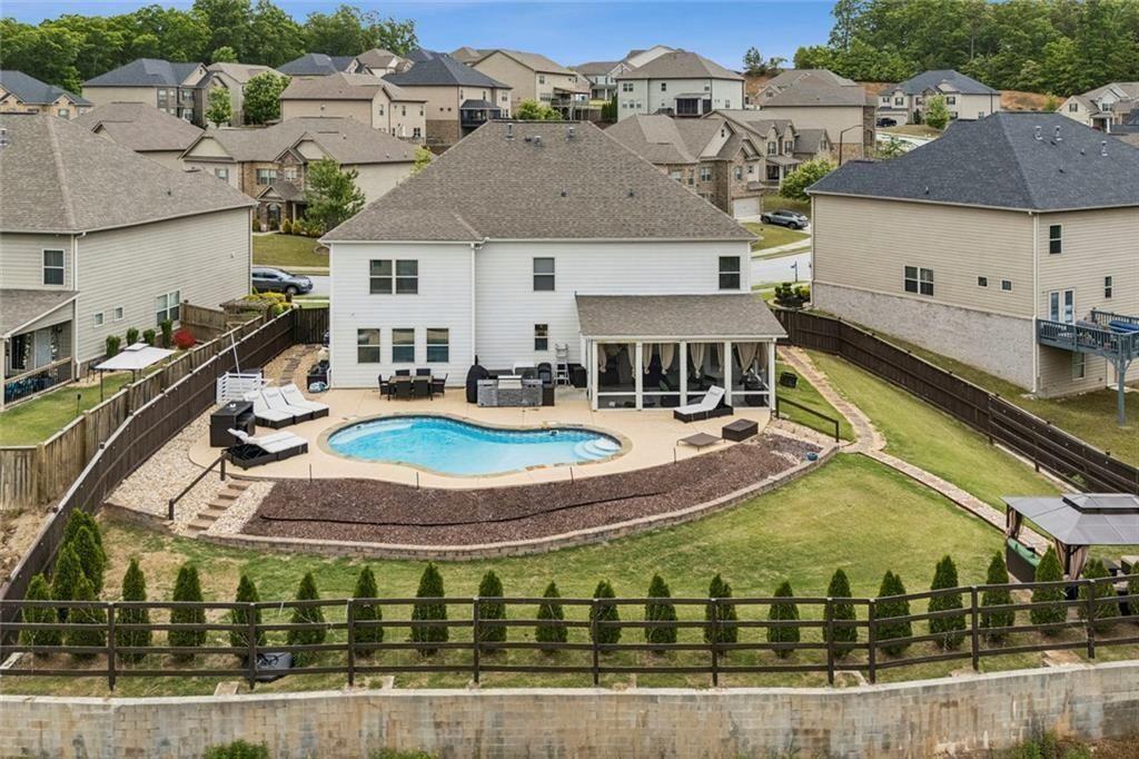 4846 Ralin Court Southwest Atlanta, GA 30331 - Photo 32 of 38 a swimming pool with outdoor seating and yard