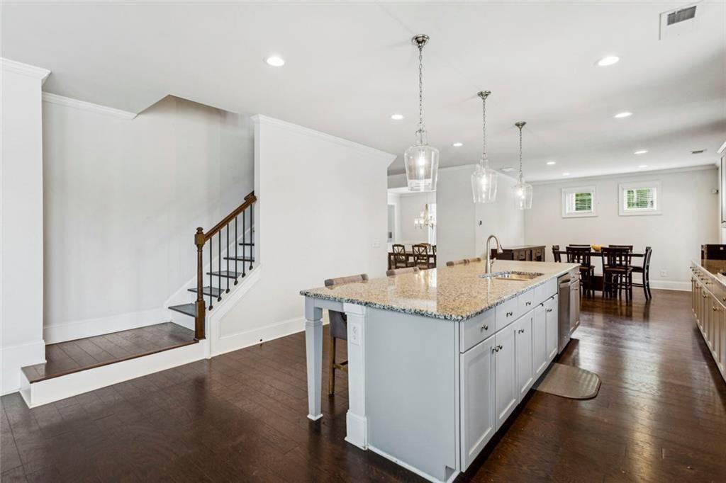 4846 Ralin Court Southwest Atlanta, GA 30331 - Photo 6 of 38 a kitchen with stainless steel appliances kitchen island a hardwood floor and a sink