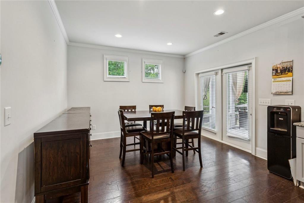 4846 Ralin Court Southwest Atlanta, GA 30331 - Photo 7 of 38 a view of a dining room with furniture and wooden floor